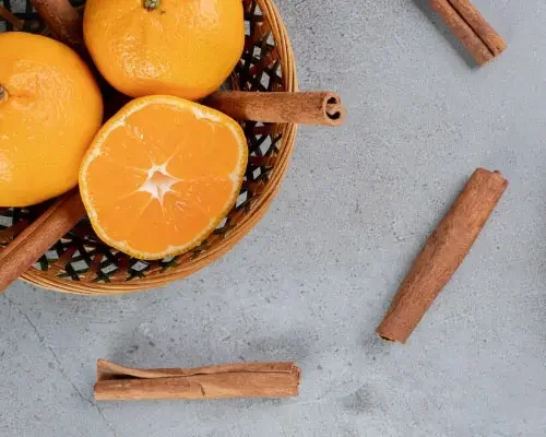 cinnamon sticks and oranges
