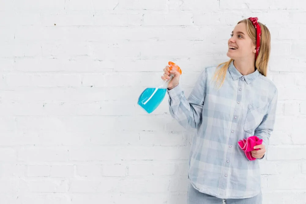 Girl with cleaning products
