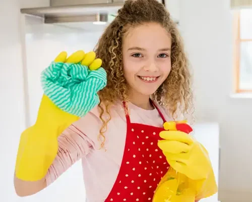 a kid dusting and wiping